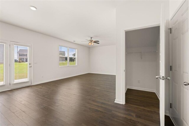 unfurnished bedroom with dark hardwood / wood-style floors and ceiling fan