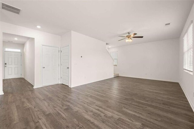 unfurnished room featuring dark hardwood / wood-style flooring and ceiling fan