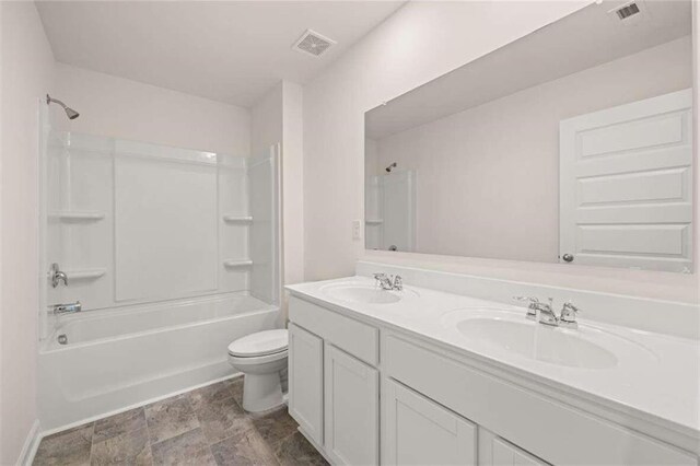 full bathroom with vanity, toilet, and shower / washtub combination