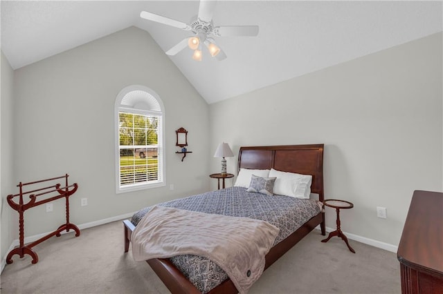 carpeted bedroom featuring vaulted ceiling, baseboards, and ceiling fan