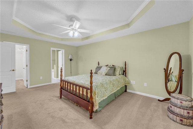 bedroom with a raised ceiling, carpet, ornamental molding, baseboards, and a ceiling fan