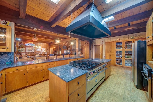 kitchen with decorative light fixtures, island exhaust hood, stainless steel appliances, glass insert cabinets, and a peninsula