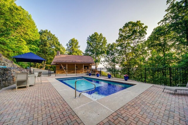 view of swimming pool with a patio area