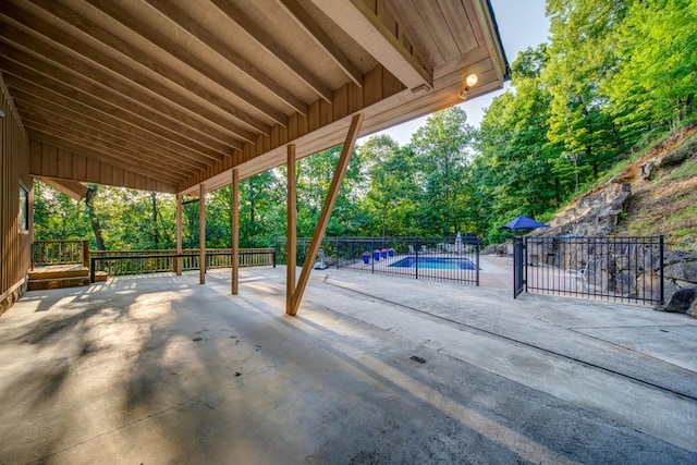 view of patio / terrace featuring a fenced in pool and fence