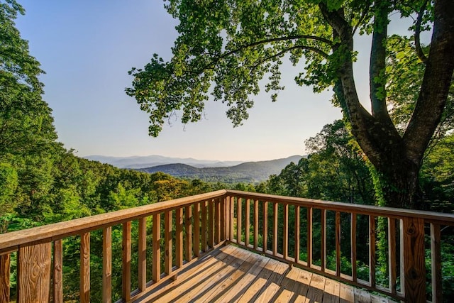 wooden terrace with a mountain view