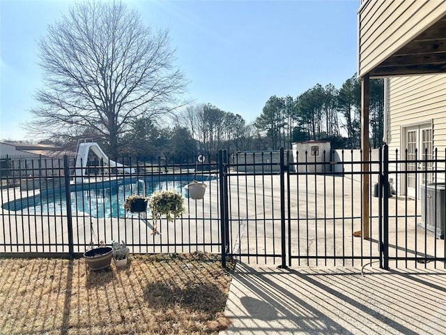 view of pool with a water slide