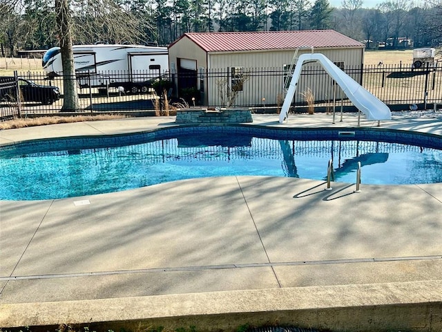 view of pool featuring a water slide