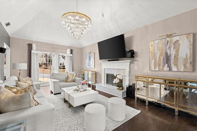 living room featuring an inviting chandelier, high vaulted ceiling, and hardwood / wood-style floors