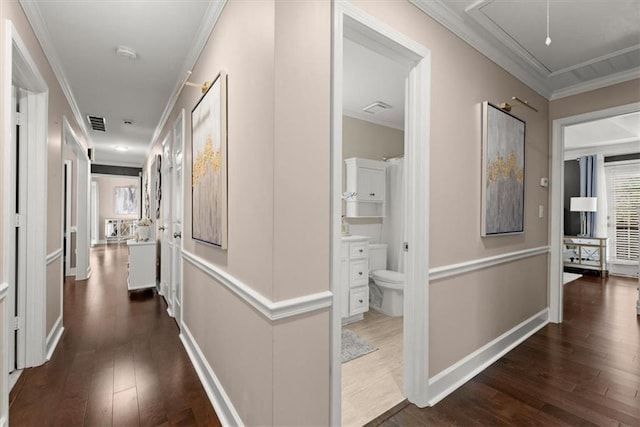 hall featuring crown molding and dark hardwood / wood-style flooring