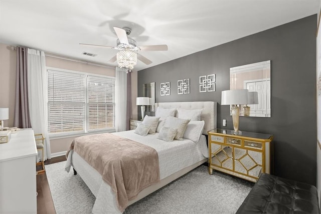 bedroom featuring dark hardwood / wood-style floors and ceiling fan