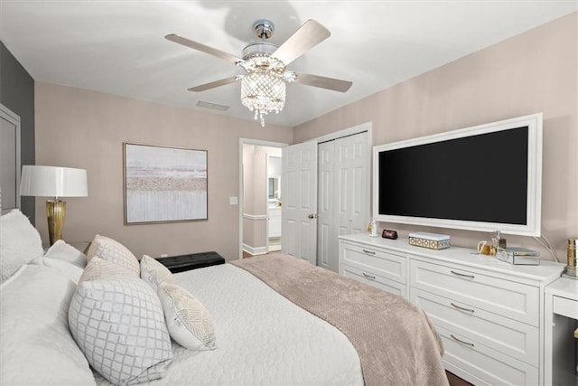 bedroom with ceiling fan and a closet