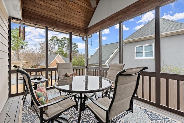 sunroom / solarium with vaulted ceiling and wood ceiling