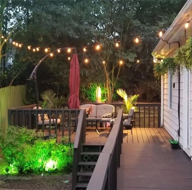 wooden deck with an outdoor living space