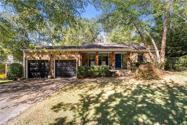 ranch-style house with a garage and a front lawn