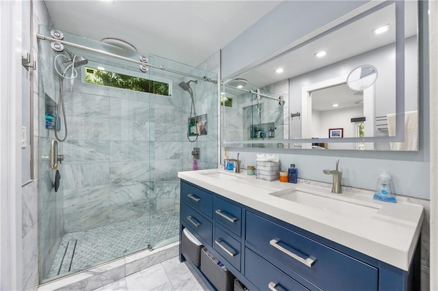 bathroom featuring vanity and a shower with shower door