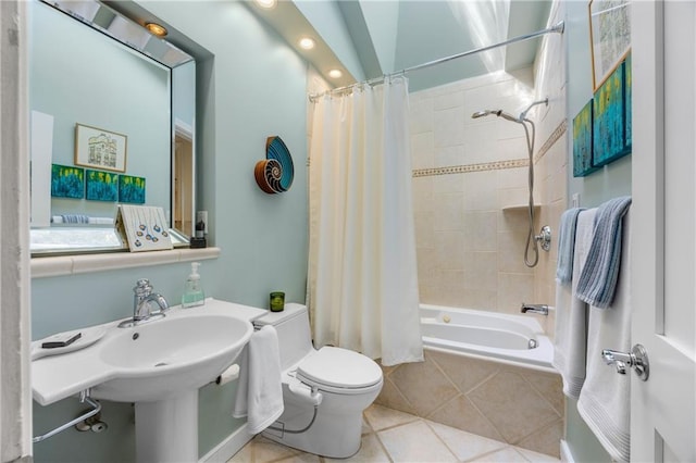 bathroom with tile patterned flooring, shower / bath combo, vaulted ceiling, and toilet