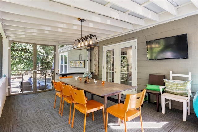 sunroom featuring french doors and beam ceiling