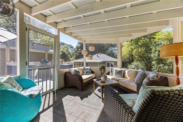 sunroom / solarium featuring lofted ceiling