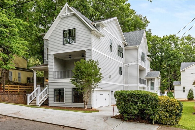 view of front of house featuring a garage and a balcony