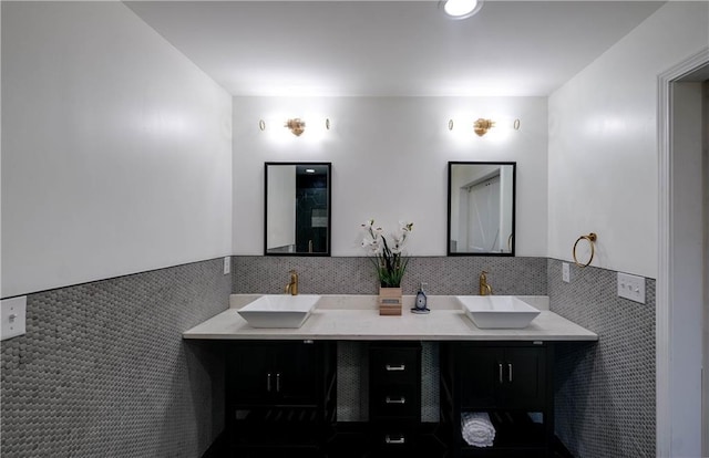 bathroom with tile walls and vanity