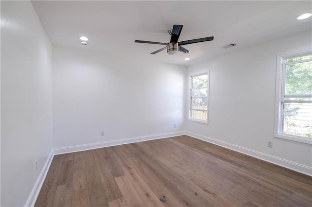 spare room with ceiling fan and light hardwood / wood-style flooring