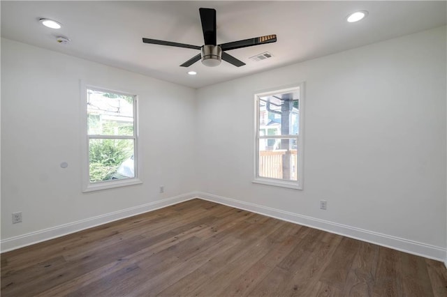 unfurnished room with ceiling fan and dark hardwood / wood-style floors