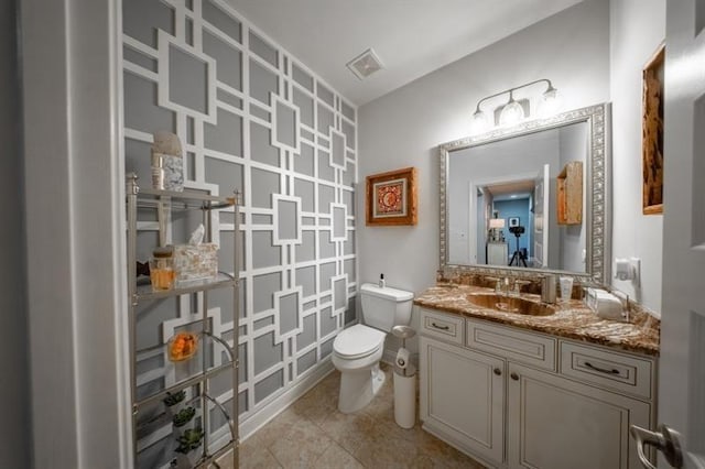 kitchen featuring a kitchen island, a breakfast bar, decorative light fixtures, stainless steel appliances, and wall chimney range hood