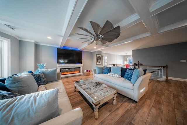 living room with coffered ceiling, beam ceiling, wood-type flooring, and ornamental molding