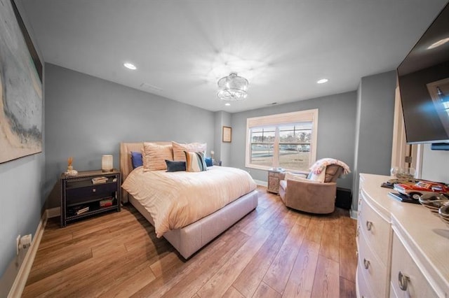 bedroom with light hardwood / wood-style floors