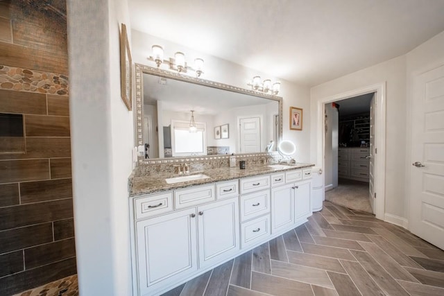 bathroom featuring vanity, parquet floors, and walk in shower