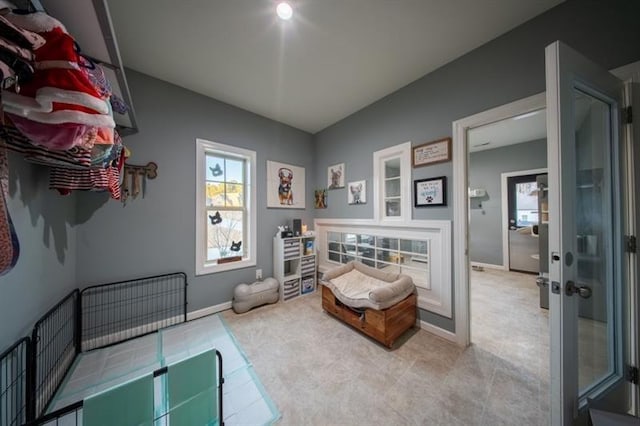 sunroom / solarium featuring ceiling fan and a wall mounted AC