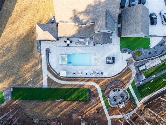 view of swimming pool with a fireplace and a patio area