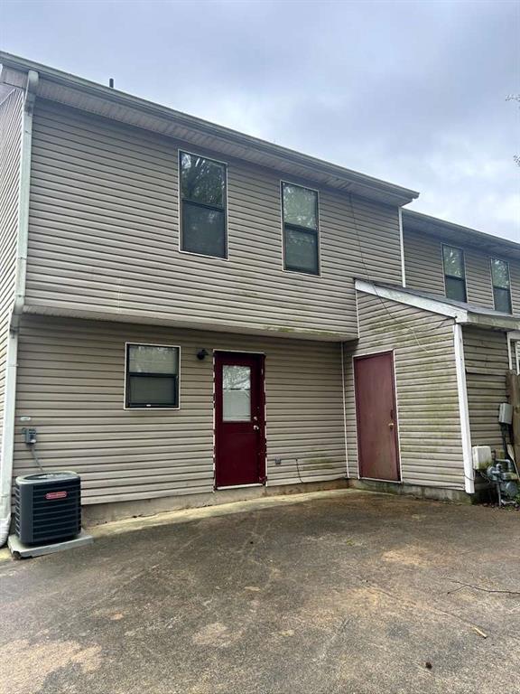 townhome / multi-family property featuring central air condition unit