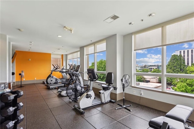 gym with recessed lighting and baseboards