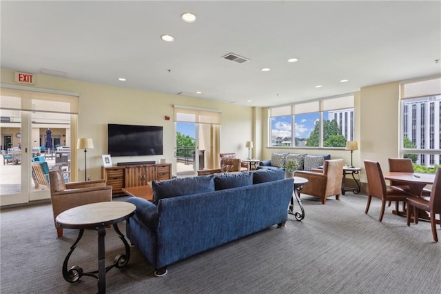 carpeted living area featuring recessed lighting