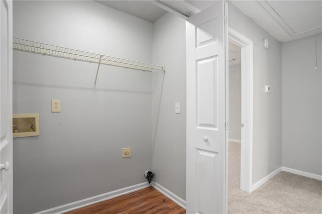 washroom featuring washer hookup and hardwood / wood-style floors