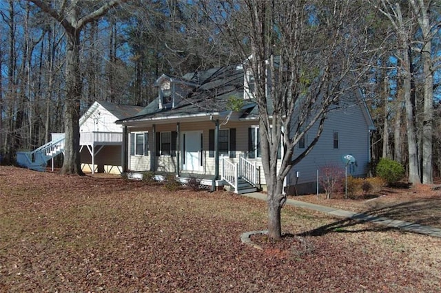 cape cod-style house with a porch