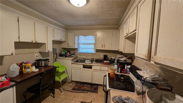 kitchen with ornamental molding, white cabinetry, white electric range, and a textured ceiling