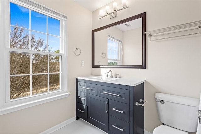 bathroom featuring vanity and toilet