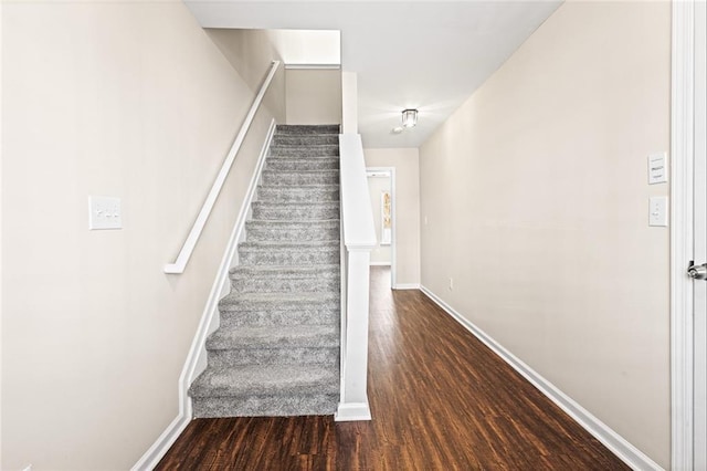 stairway featuring hardwood / wood-style flooring