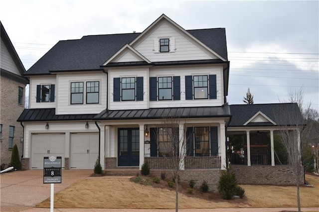 view of front facade with a garage and a porch