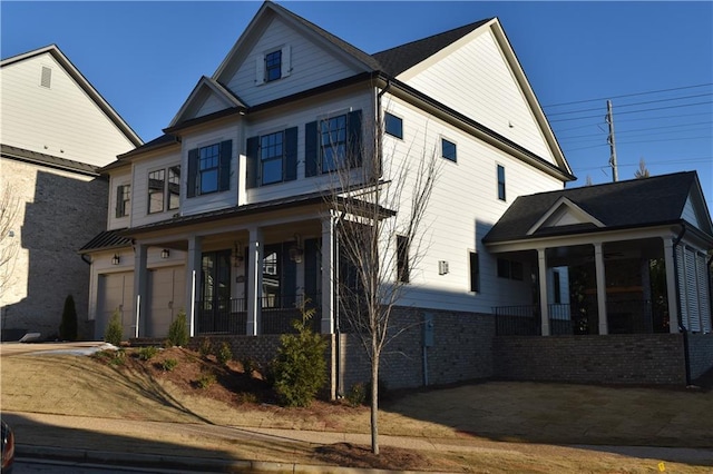 view of front facade featuring a garage and a porch