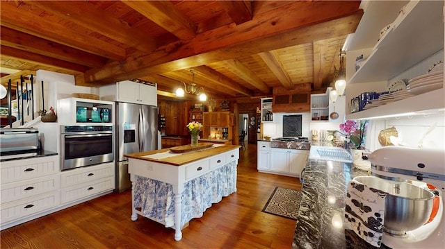 kitchen featuring dark wood-style flooring, wood ceiling, appliances with stainless steel finishes, a center island, and open shelves