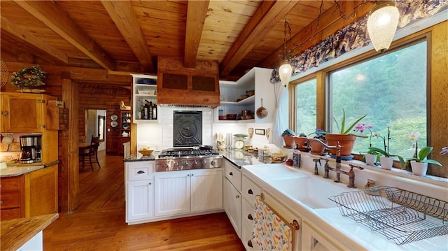 kitchen featuring wooden ceiling, stainless steel gas cooktop, wood finished floors, beam ceiling, and open shelves