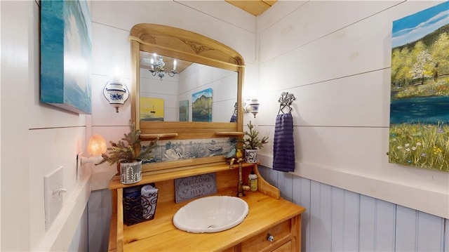 bathroom featuring vanity and an inviting chandelier