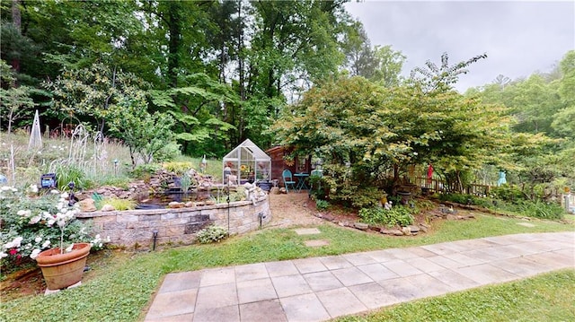 view of yard with an outbuilding and an exterior structure