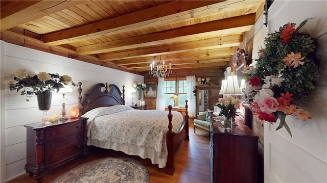 bedroom with wooden ceiling, a chandelier, wood finished floors, and beamed ceiling