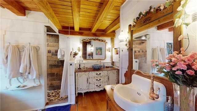 bathroom with wooden ceiling, wood finished floors, vanity, beamed ceiling, and walk in shower