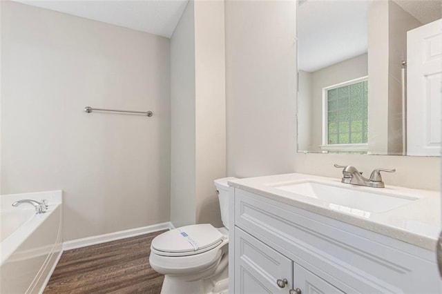 7420 Bristol Cir, Douglasville, GA 30134 - full bath with wood finished floors, vanity, and a garden tub