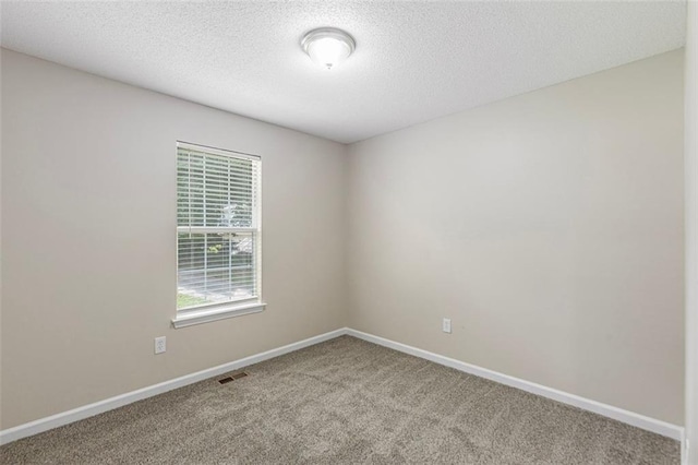 7420 Bristol Cir, Douglasville, GA 30134 - empty room with carpet flooring and a textured ceiling